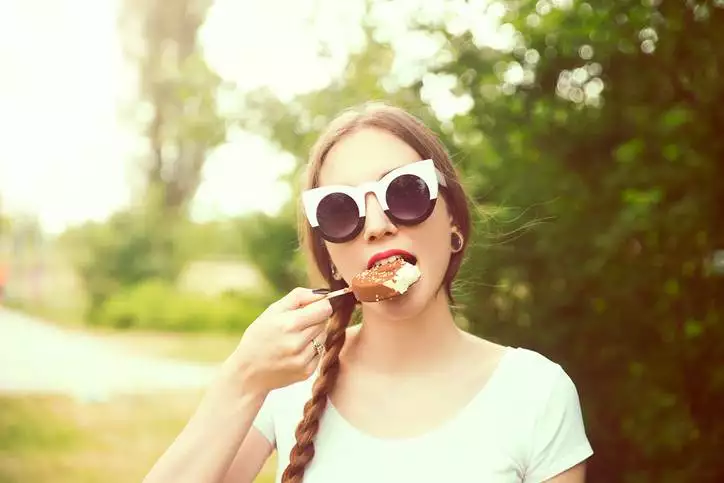 Young woman eating ice cream